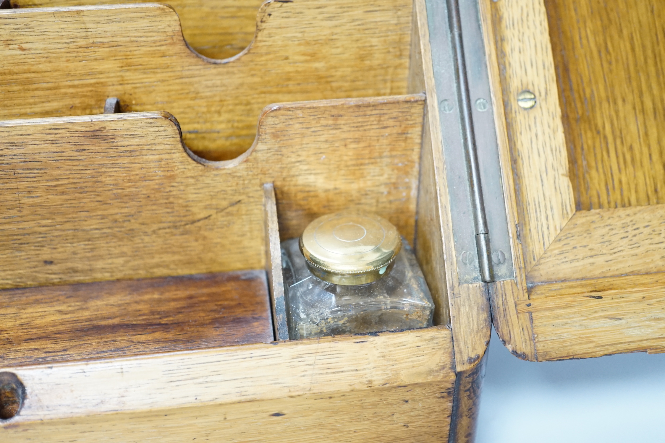 An Edwardian oak stationery casket, 31cm high, 38cm wide, 21.5cm deep